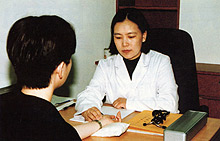 Physician taking pulse