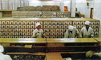 A busy herbal pharmacy in one of Beijing's TCM hosptials showing different herbs used in tonic preparations.
